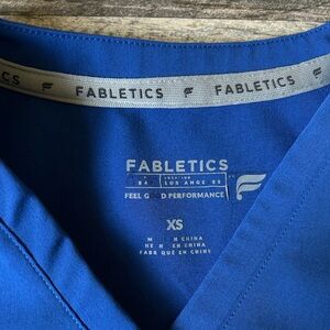 Worn only once. Fabletics scrub set xs top xs bottom